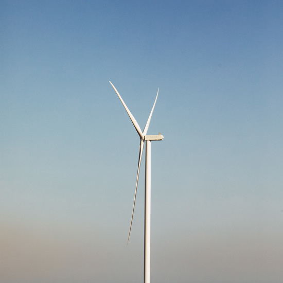 Picture of a white construction van outside at a windfarm