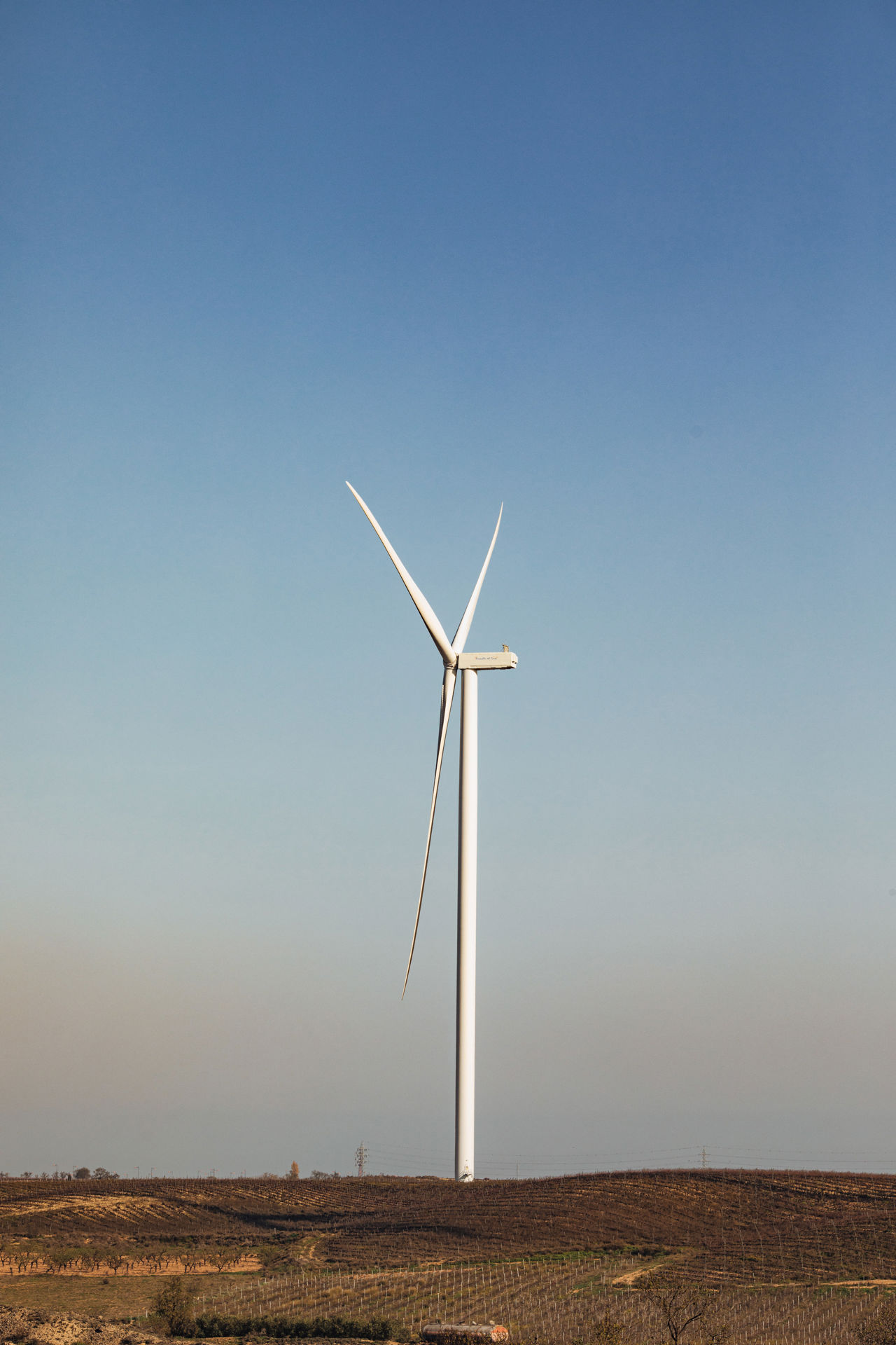 Picture of a white construction van outside at a windfarm